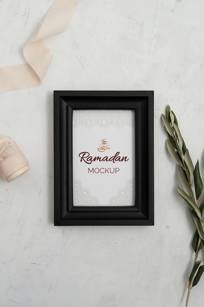 PSD flat lay of frame mockup with candle, sweets and leaves