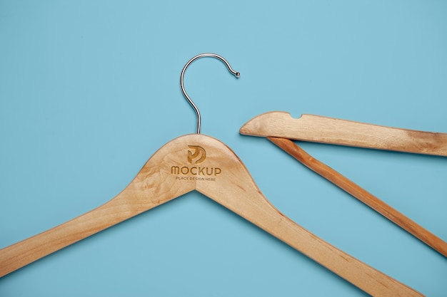 PSD flat lay hangers on blue background