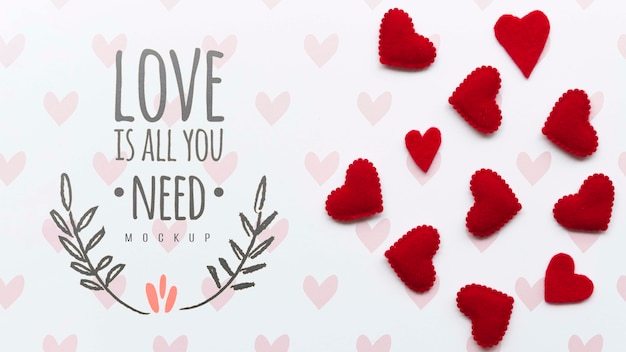 PSD flat lay of heart decorations with message