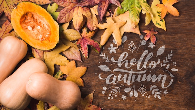 Flat lay leaves frame on wooden background