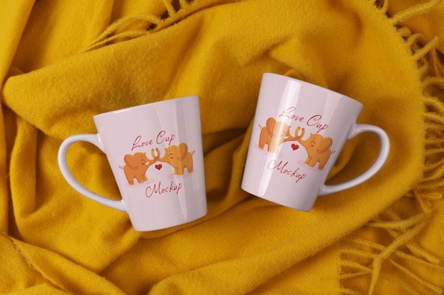 Flat lay love cups on yellow cloth