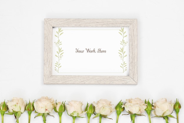 PSD flat lay mockup beige photo frame with flowers