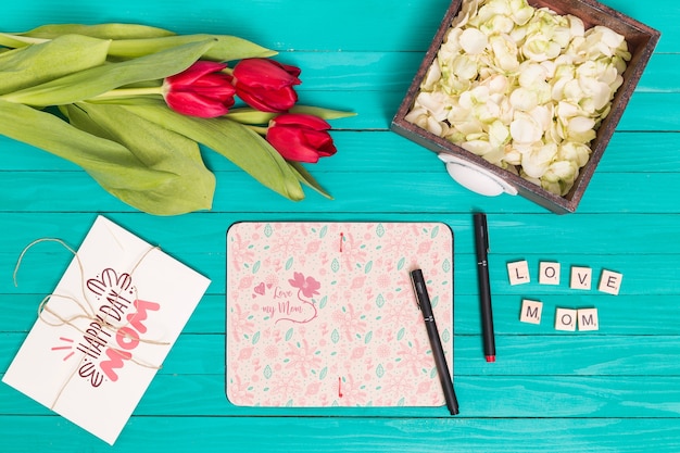 PSD flat lay mothers day composition with open book mockup
