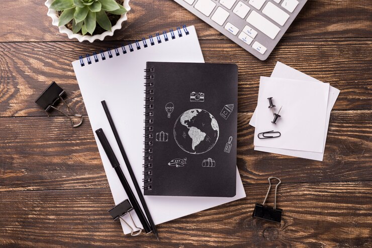 PSD flat lay notebook mock-up and stationery near succulent plant and keyboard