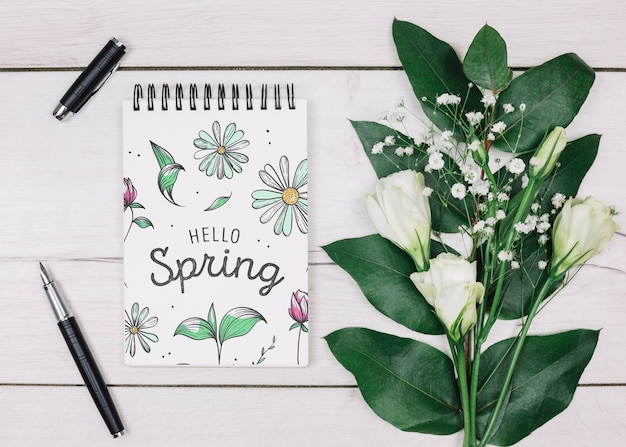 PSD flat lay notepad mockup with spring concept