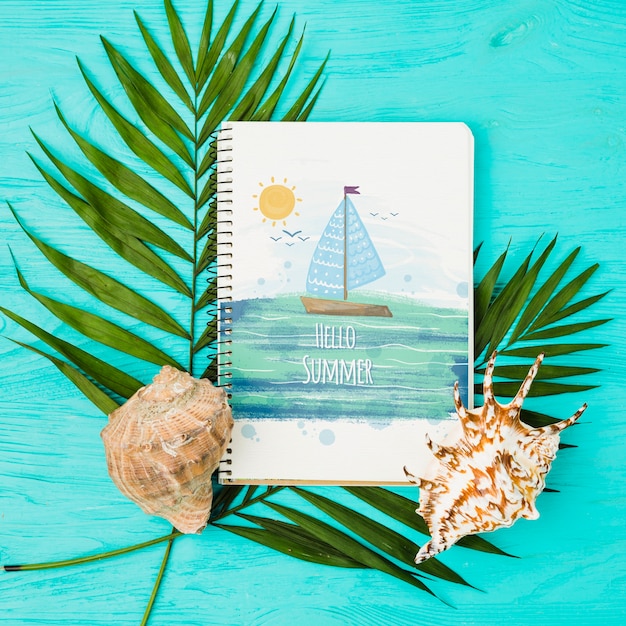 Flat lay notepad mockup with summer elements