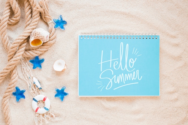 Flat lay notepad mockup with summer elements