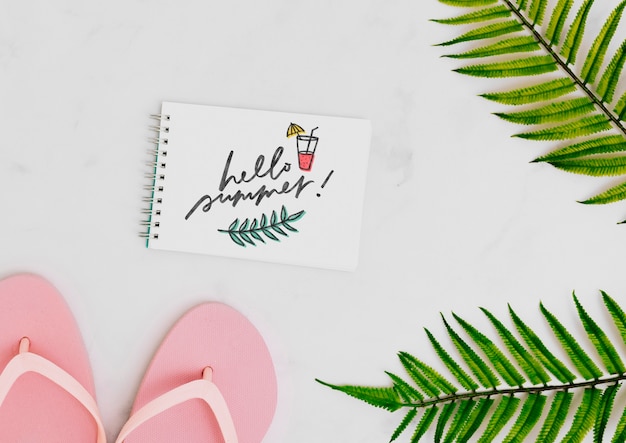 Flat lay notepad mockup with summer elements