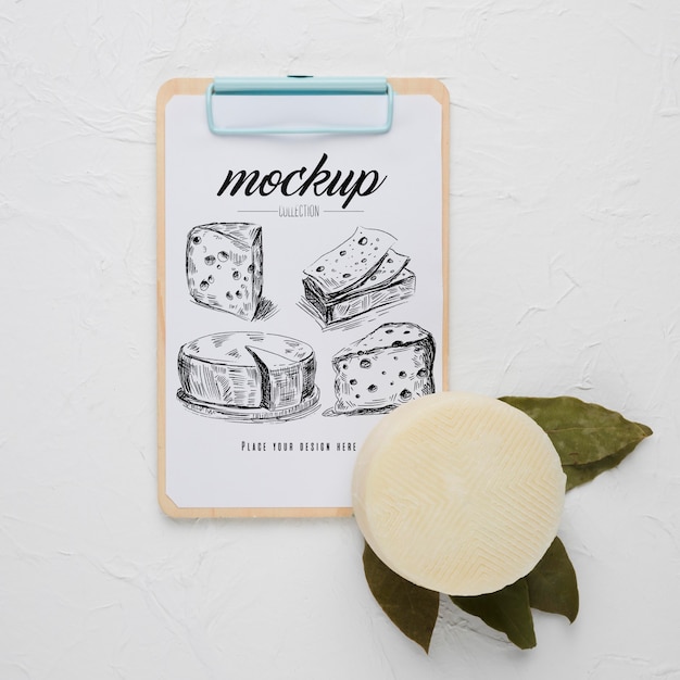 PSD flat lay of notepad with cheese