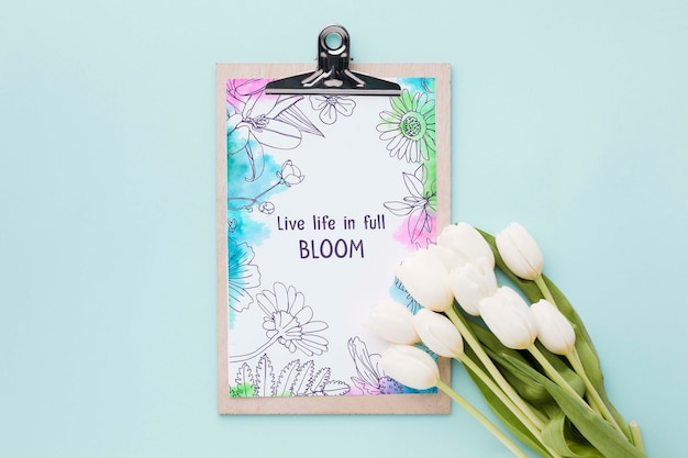 PSD flat lay of notepad with spring tulips