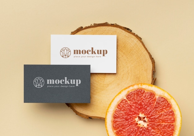 PSD flat lay of paper stationery with wood and citrus