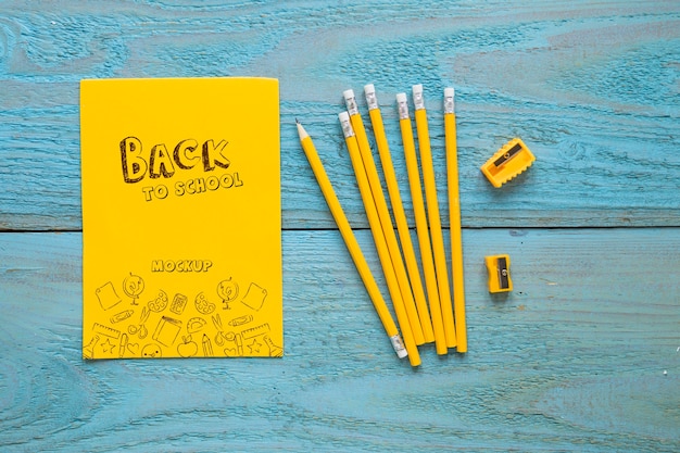 Flat lay pens on wooden background