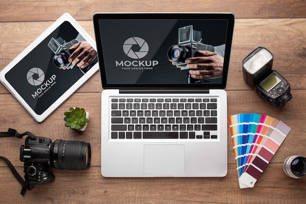 Flat lay of photographer wooden workspace with laptop