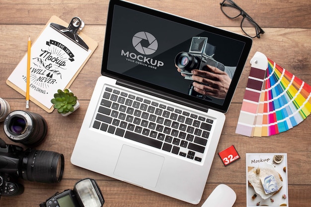PSD flat lay of photographer wooden workspace with laptop