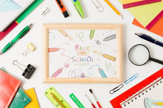 Flat lay school arrangement with board on white background