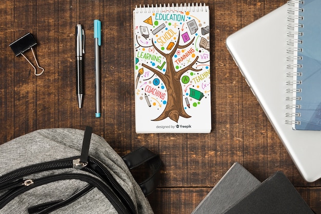 Flat lay school supplies on wooden background