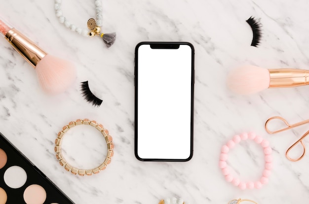 PSD flat lay smartphone mock-up with make-up accessories
