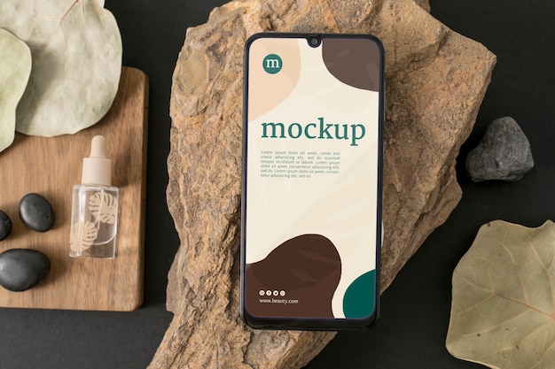 Flat lay of smartphone mockup with cosmetic products