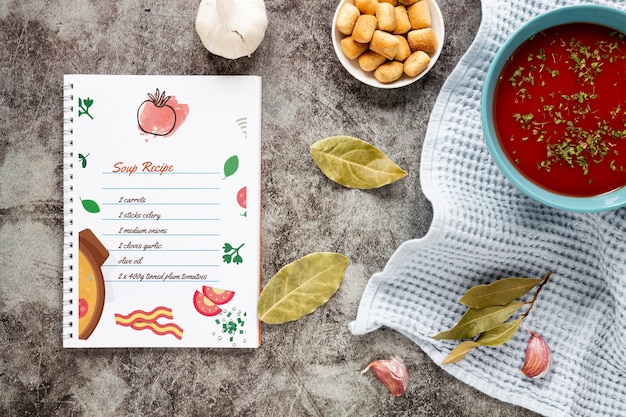 Flat lay soup with composition of ingredients and recipe mock-up