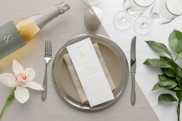 Flat lay of spring menu mock-up on plates with wine bottle and cutlery