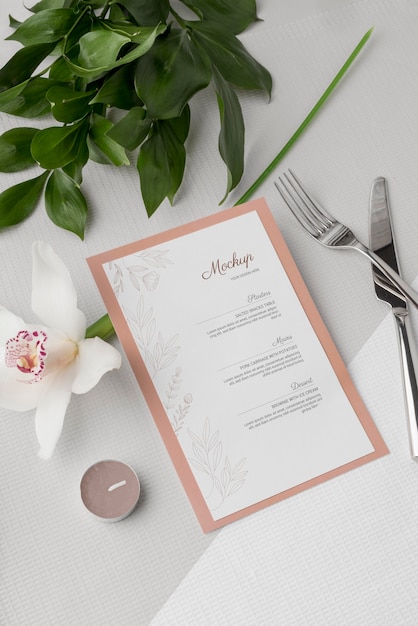 flat lay of spring menu mock-up with cutlery and flowers