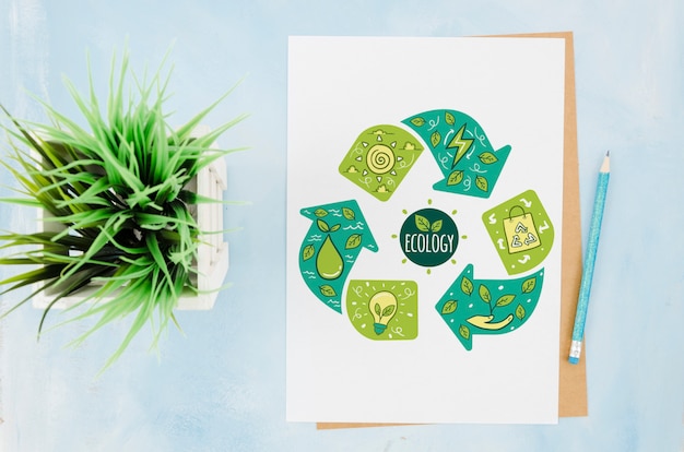 Flat lay stationery paper mock-up with plant