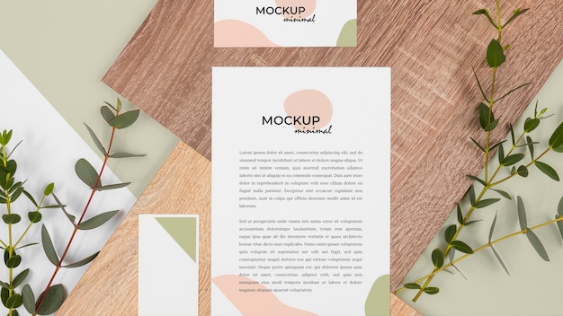 flat lay stationery with leaves and wood