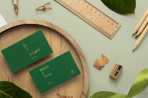 Flat lay stationery with wood and plant