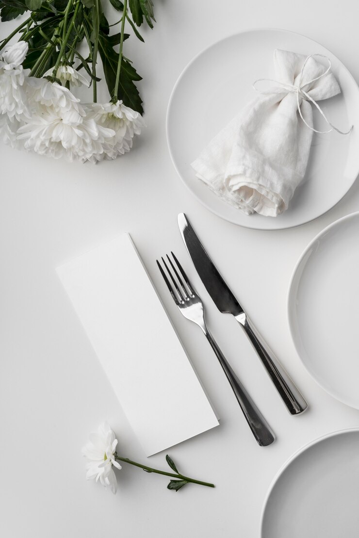 PSD flat lay of table arrangement with spring menu mock-up and cutlery