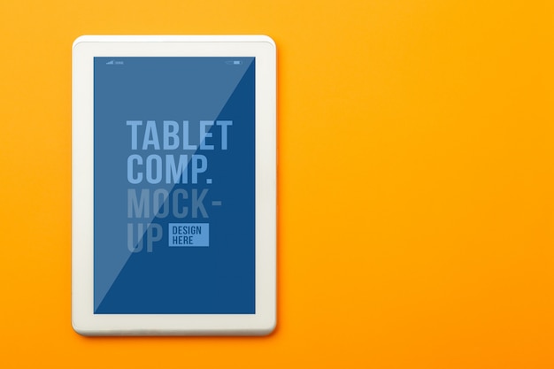 PSD flat lay, top view of orange office table desk with tablet computer mockup template for your design. modern working space