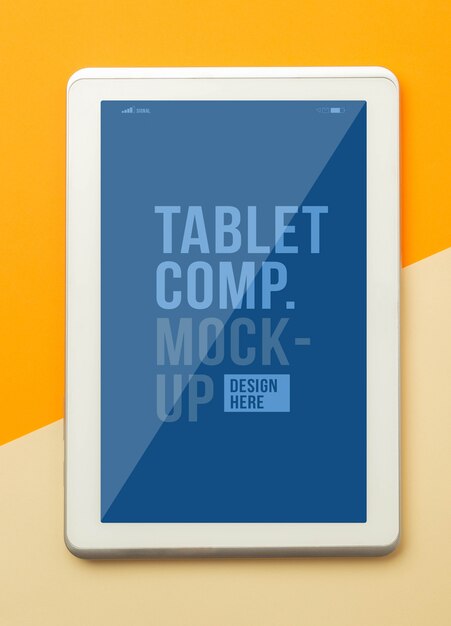 Flat lay, top view of orange office table desk with tablet computer mockup template for your design.