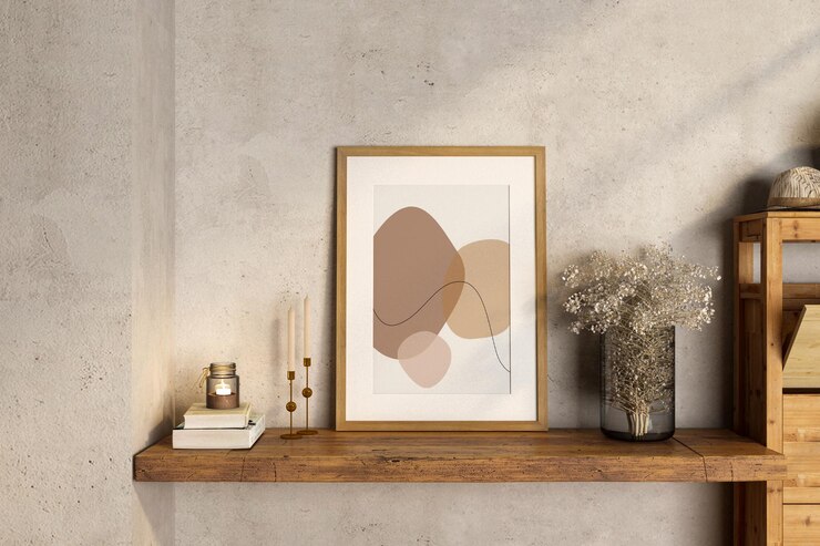 Floral composition with empty frame on table