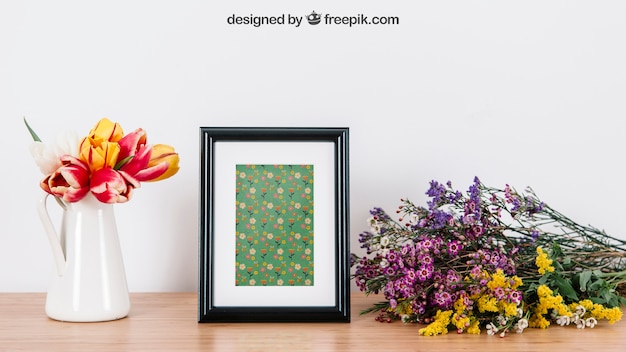 PSD floral mockup of frame on desk