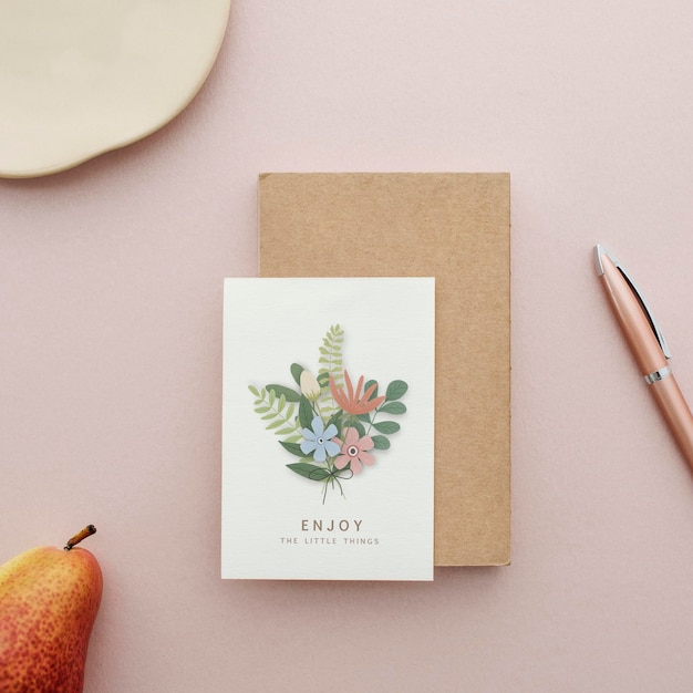 Floral postcard mockup on a pink surface