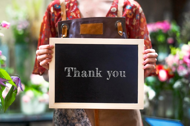 PSD florist holding a thank you board sign mockup