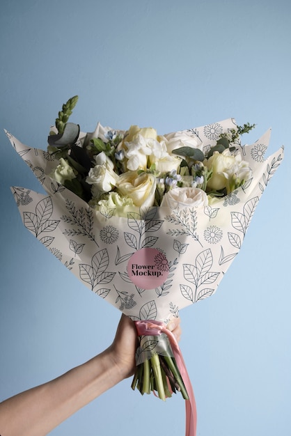 flower packaging cone mock-up with beautiful flowers bouquet