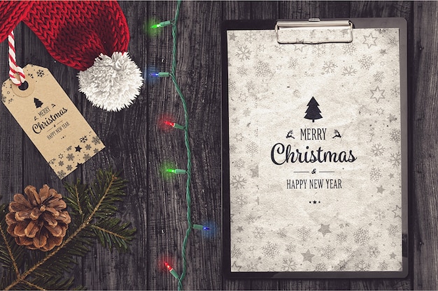 Folder on wooden background mockup with christmas design