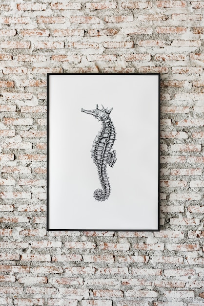 PSD foto van seahorse van de handtekening hangt op de muur