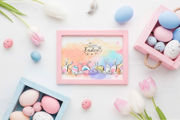 Frame of flowers and painted eggs