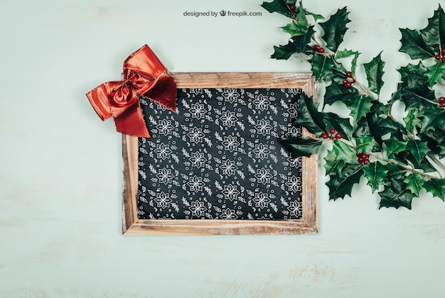 PSD frame and leaves mockup with christmtas design