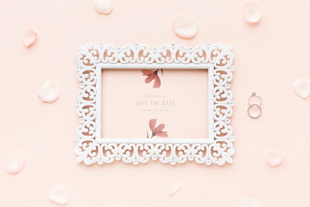 PSD frame mock-up and wedding rings with flowers