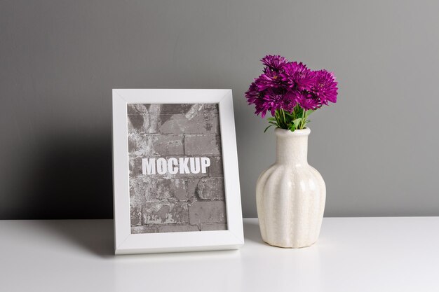 Frame mockup for artwork photo or painting presentation with flowers in vase