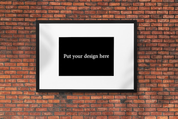 A frame mockup on a brick wall