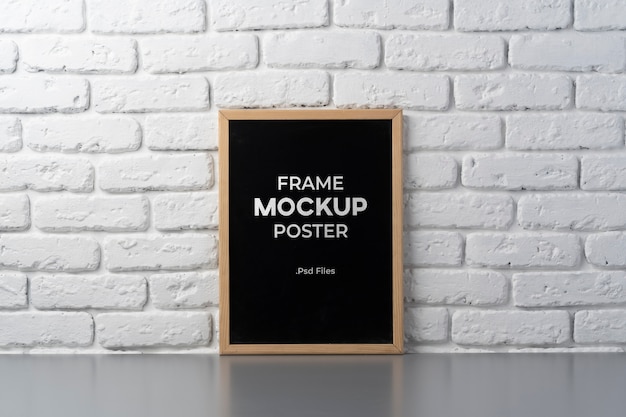 Frame mockup hanged on brick wall