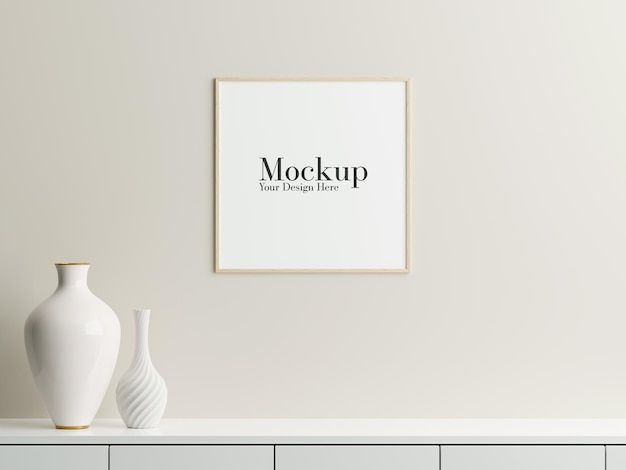 Frame mockup hanging on the wall with decorative vase on top of table