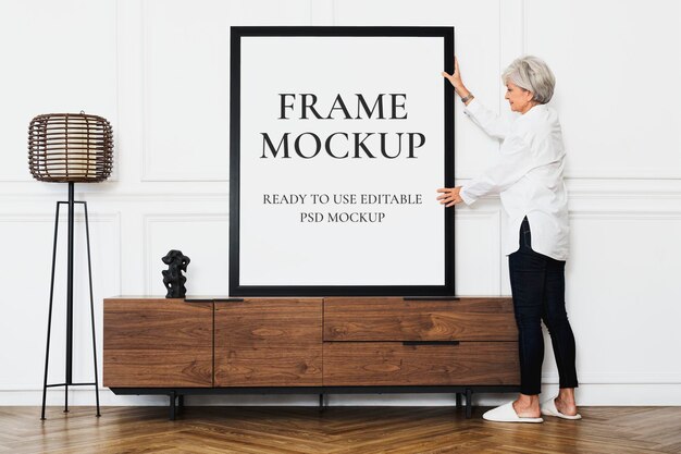 Frame mockup psd in a scandinavian decor living room