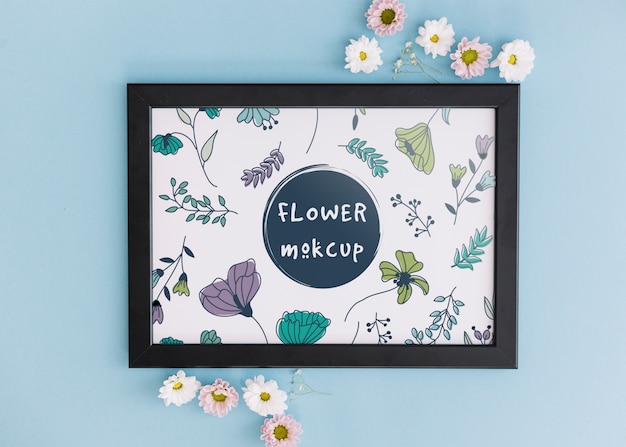 frame mockup with floral decoration