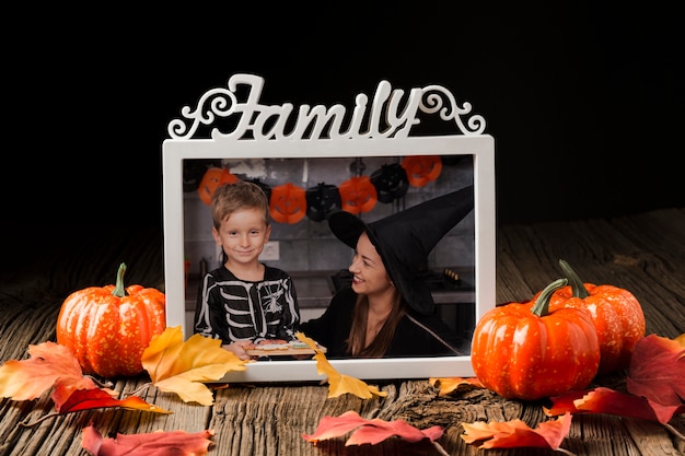 Frame with halloween picture and pumpkins