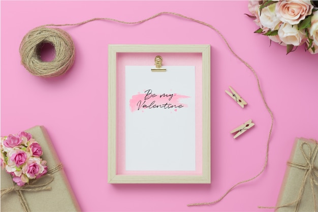 Frame with kraft present boxes and craft rose flower mockup