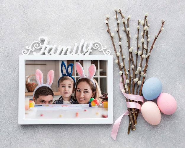 Frame with photos and cotton branches